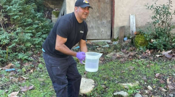 Robert Bowers with a sampling container